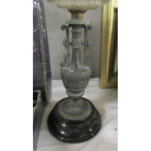 2297 - An oil lamp base with glass font.