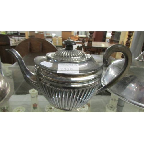 2350 - A silver plate teapot, meat cover and tureen lid.