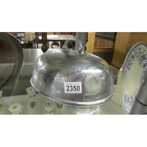 2350 - A silver plate teapot, meat cover and tureen lid.