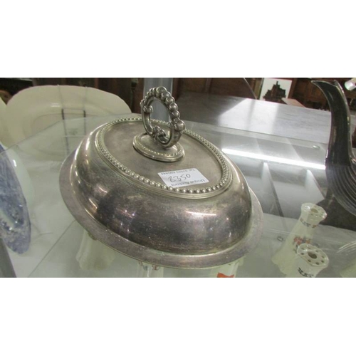 2350 - A silver plate teapot, meat cover and tureen lid.