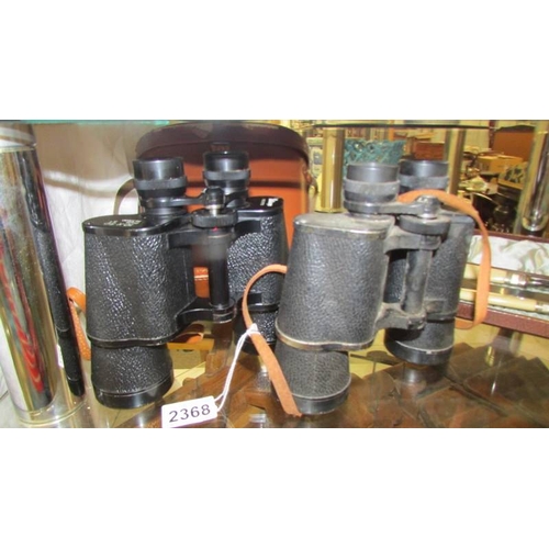 2368 - Two pair of binoculars - one cased Pathescope 10 x 50 and uncased Silraft 10 x 50.