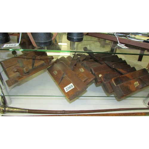 2369 - Ten antique wood working planes.