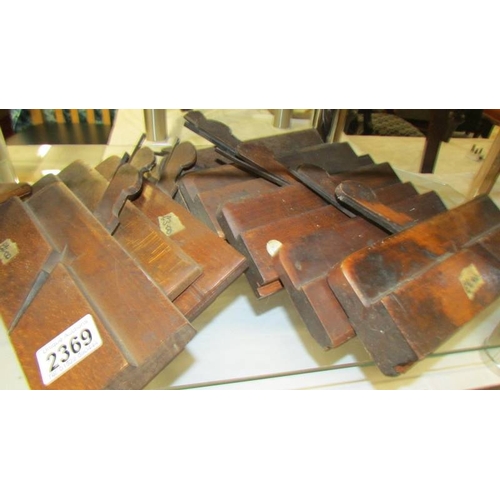 2369 - Ten antique wood working planes.