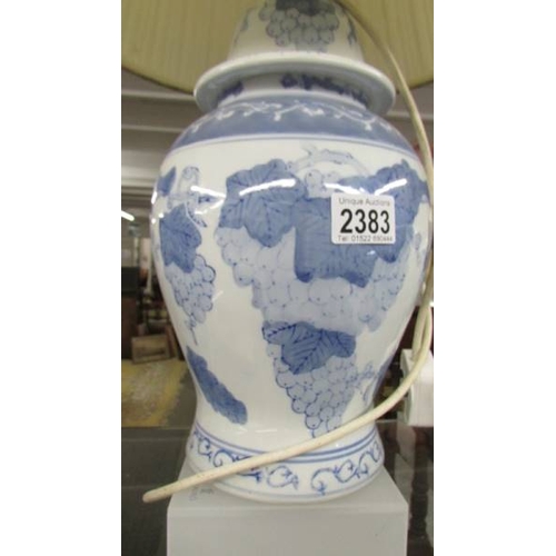 2383 - A blue and white Chinese table lamp with shade.  (Collect only)