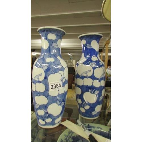 2384 - A pair of modern blue and white vases.