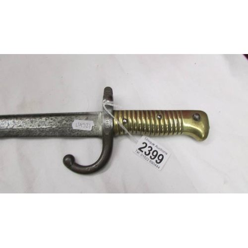 2399 - An old bayonet with brass hilt, No. A29926.