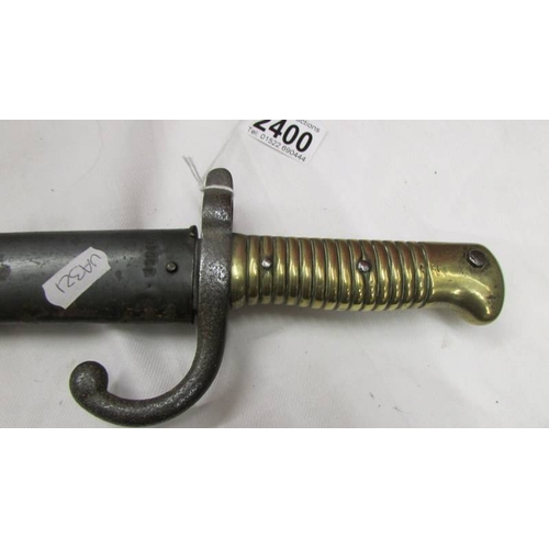 2400 - An old bayonet with brass hilt, No. S29940.