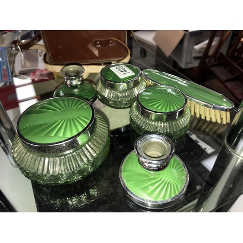 1409 - An art deco green glass chrome dressing table set