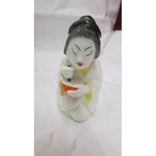 2097 - Four Royal Worcester candle snuffers - Mandarin, Chinese Girl, Monk and Nun.