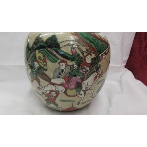 2102 - A Chinese/Japanese ginger jar depicting fighting figures. (Collect only)