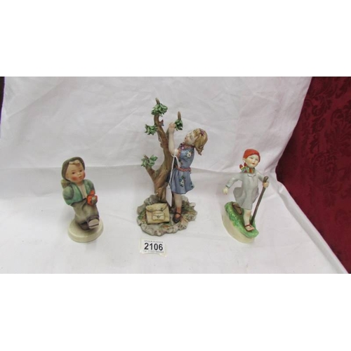 2106 - A figure of a girl with butterfly marked with a crown over the letter N, a Goeble boy figure and ano... 