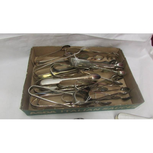 2108 - 25 pairs of EPNS sugar tongs.