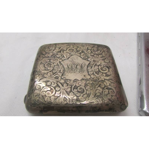 2115 - A silver monogrammed cigarette case and another featuring a map of Africa.