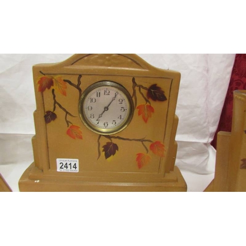 2414 - A 1930's ceramic clock garniture (not working).