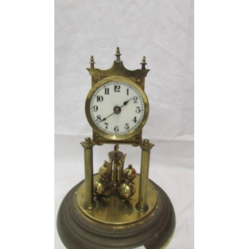 2416 - A 1905 Juhresuhren Fabrik anniversary clock under glass dome, need new feather and no key. (Collect ... 