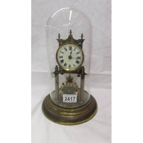 2417 - A 1908 Jahresuhren Fabrik anniversary clock under glass dome, no key. (Collect only)