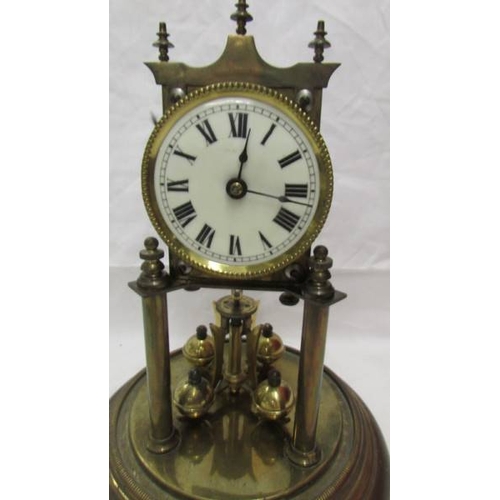 2417 - A 1908 Jahresuhren Fabrik anniversary clock under glass dome, no key. (Collect only)