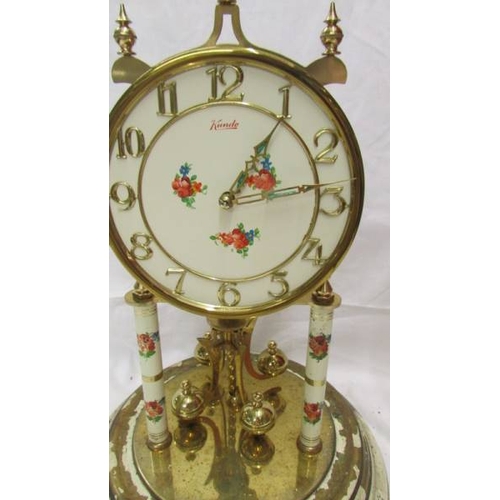 2420 - A Kundo anniversary clock under glass dome, needs new feather. (Collect only)