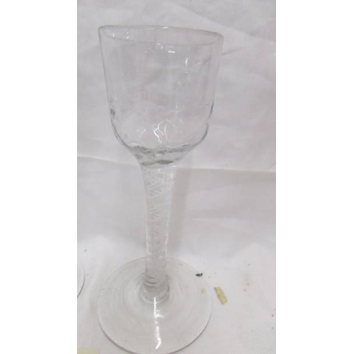 2423 - Two antique liquor glasses with spiral stems.