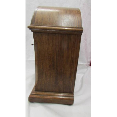 2427 - A mahogany inlaid 8 day mantel clock. (Collect only)