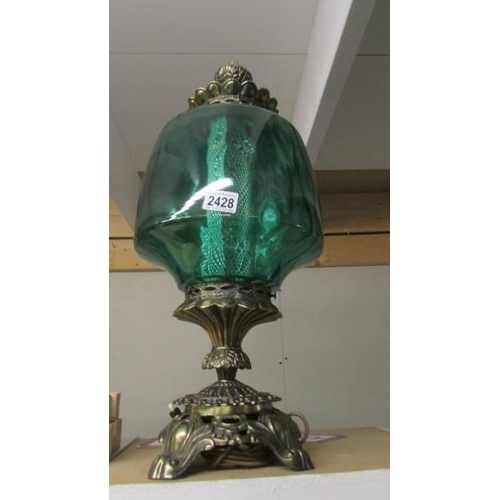 2428 - A large metal and green glass lamp. (Collect only)