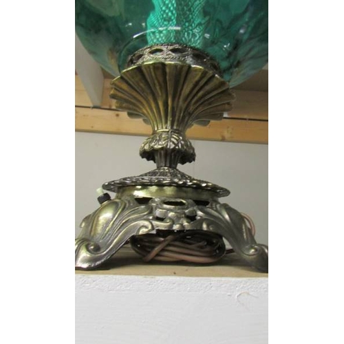 2428 - A large metal and green glass lamp. (Collect only)