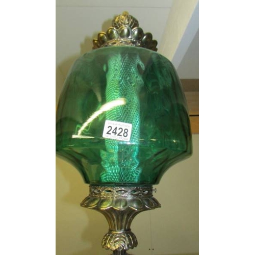 2428 - A large metal and green glass lamp. (Collect only)