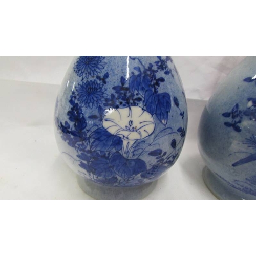 2441 - A pair of blue Chinese vases.