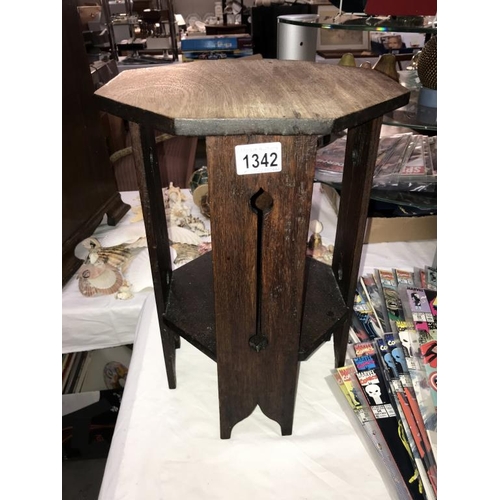 1342 - An arts & craft octagonal table & a wooden letter rack (height of table 41cm)