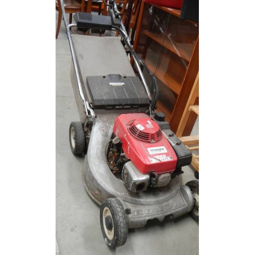 102 - A Honda HR216 petrol mower. (collect only)