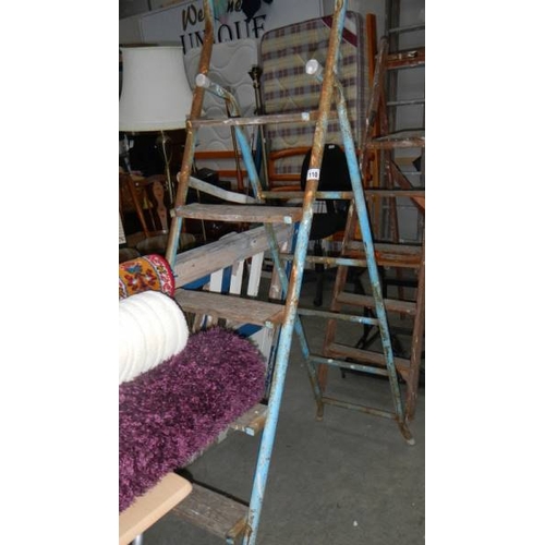 110 - A metal and wood step ladder. (collect only)