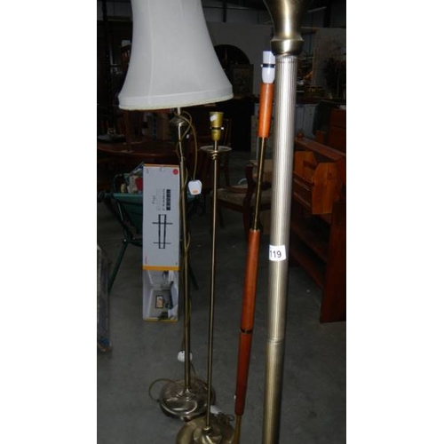 119 - Four brass and wood standard lamps. (collect only)