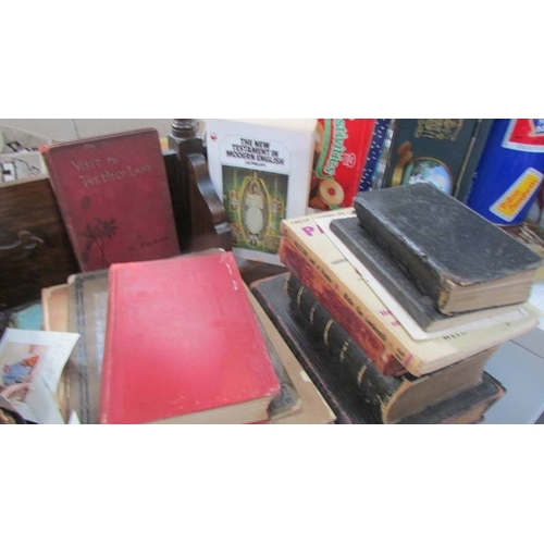 141 - A quantity of bibles and other religious books.