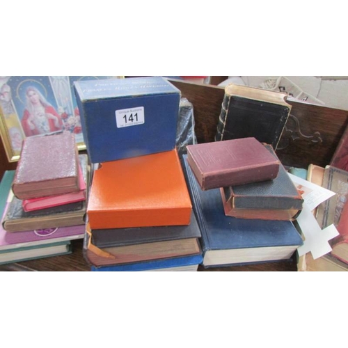 141 - A quantity of bibles and other religious books.