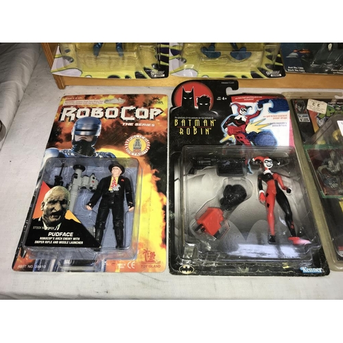 1445 - A collection of mainly unopened action figures comic & TV related including DC Harley Quinn with kno... 