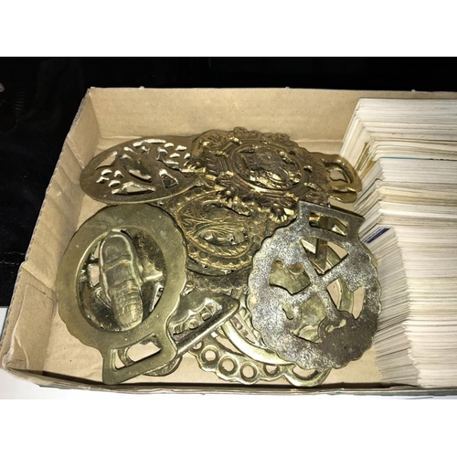 1450 - A quantity of brass horse brasses & Brooke Bond collector cards