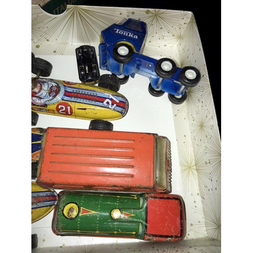 1451 - A quantity of 1950's tin plate racing cars including Tonka jeep etc.