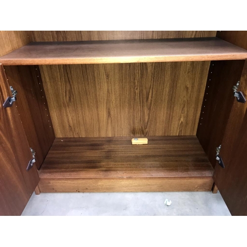 1478 - A teak veneered 2 door cupboard