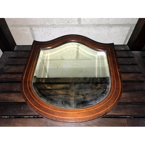 1492 - An Edwardian inlaid mahogany bevel edge shield shaped wall mirror (31.5cm x 34cm)