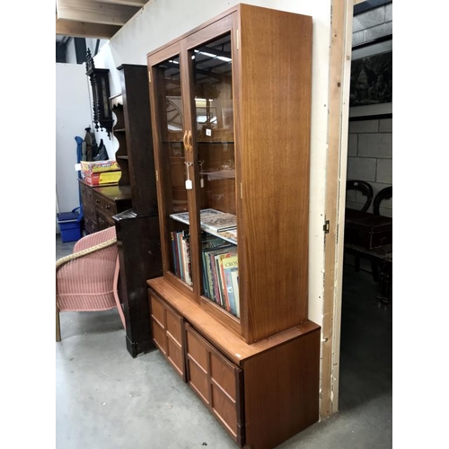 1541 - A teak Parker Knoll display cabinet with base (103cm x 46cm x 183cm high)