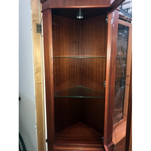 1555 - A light mahogany effect corner cupboard