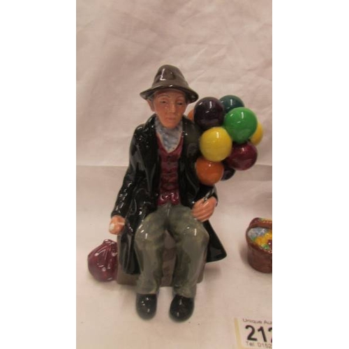 2124 - Two Royal Doulton figurines - ''The Balloon Man'' HN 1954 and ''The Old Balloon Seller'' HN 1315.