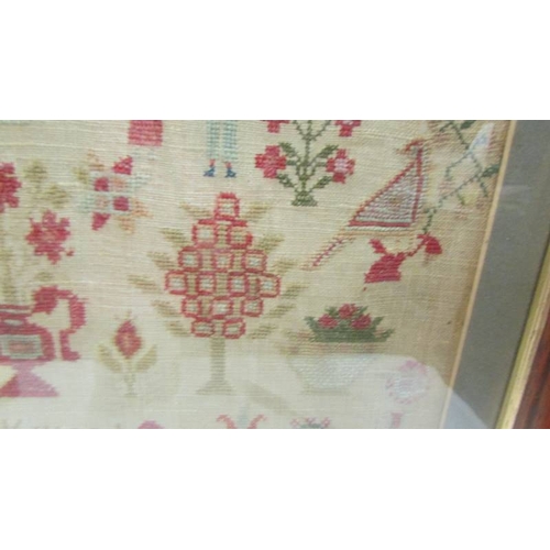 2140 - A 19th century framed and glazed sampler by Hannah Lockwood.