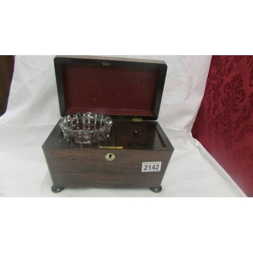 2142 - A Victorian mahogany tea caddy complete with glass mixing bowl.