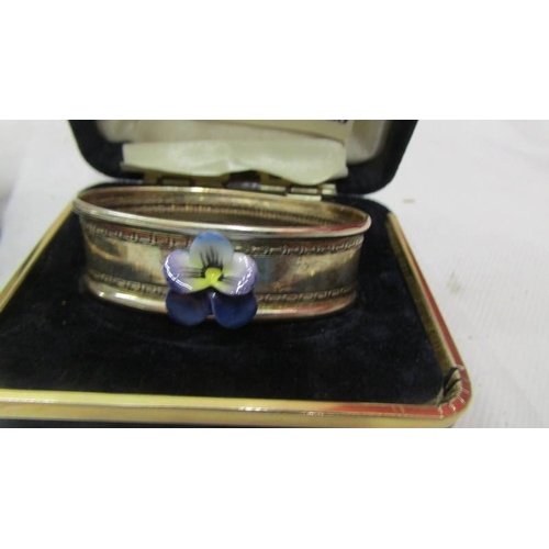 2145 - A Crown English collectables silver pill box and napkin ring decorated with hand painted porcelain f... 