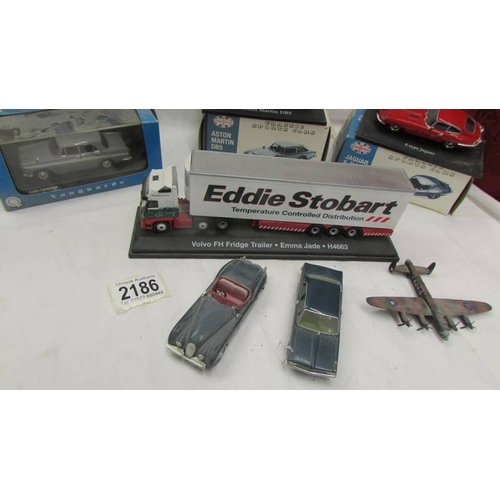 2186 - A quantity of die cast models including boxed Aston Martin DB5, Jaguar E Type etc.,