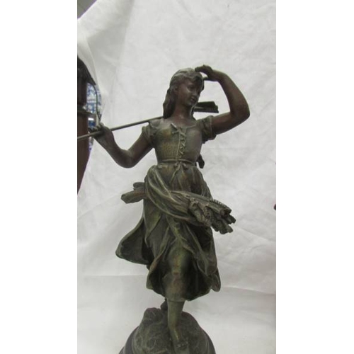 2448 - A pair of spelter figures, 38 cm tall.