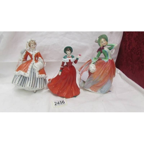 2456 - 3 Royal Doulton figurines - Winter's Day HN 4589, Autumn Breezes HN 1911 and Noelle HN 2179.