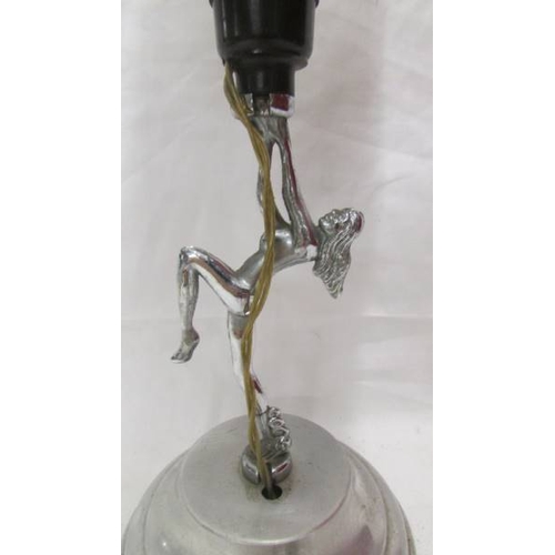 2457 - An art deco chrome figurine table lamp complete with shade.