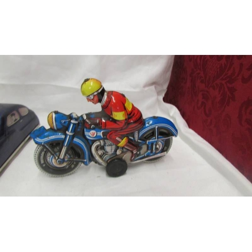 2462 - A tinplate Mettoy police car and Western Germany and Spanish motor cycles.